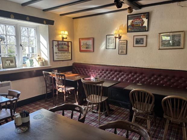 Interior of The Swan Inn Abbotsbury showcasing traditional pub decor